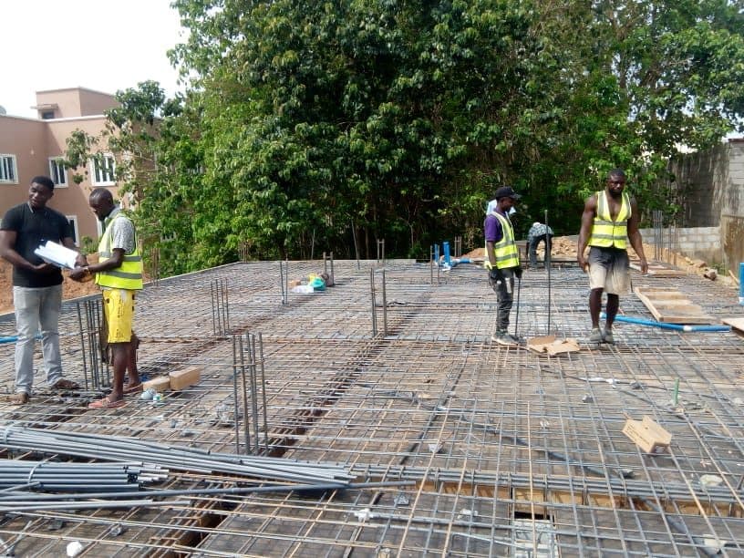 Crew setting out conduit across the deck