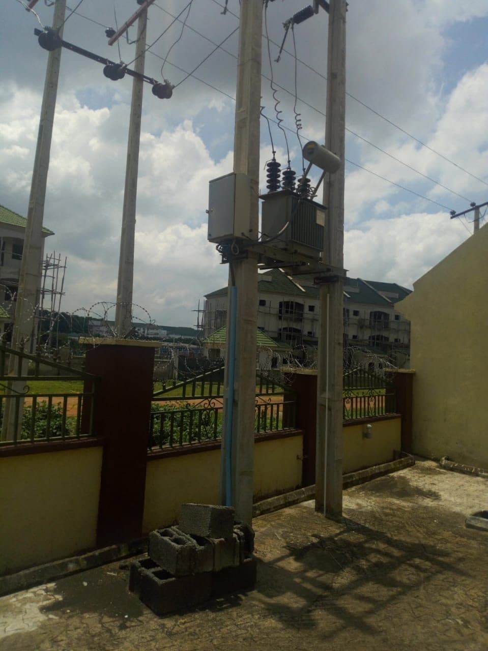Pole-mounted transformer in a built-up area